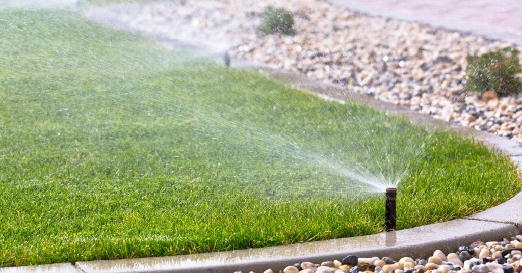 Sprinkler system watering a lawn